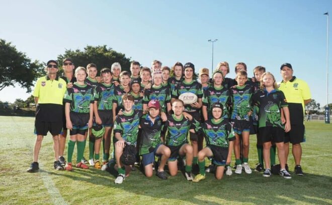 Young Rugby Athletes group picture celebrating small win at Proserpine Whitsunday Junior Rugby League